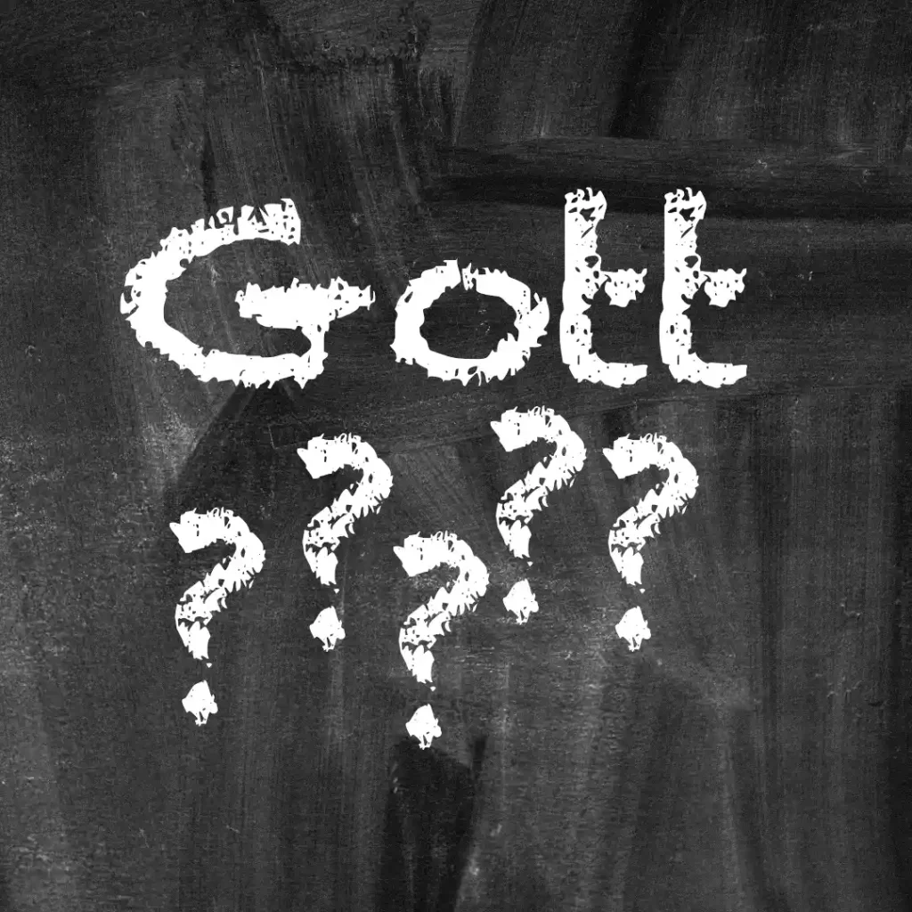 Das Bild zeigt eine schwarze Tafel (wie früher in der Schule). Text: "Gott ??????".
